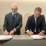 Da sn Massimiliano Burelli e Giuseppe Argirò alla firma dell'accordo